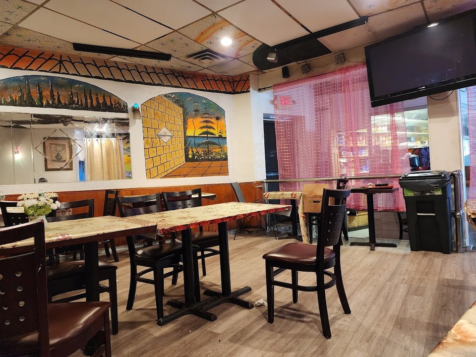 West African dishes on a casual restaurant table.